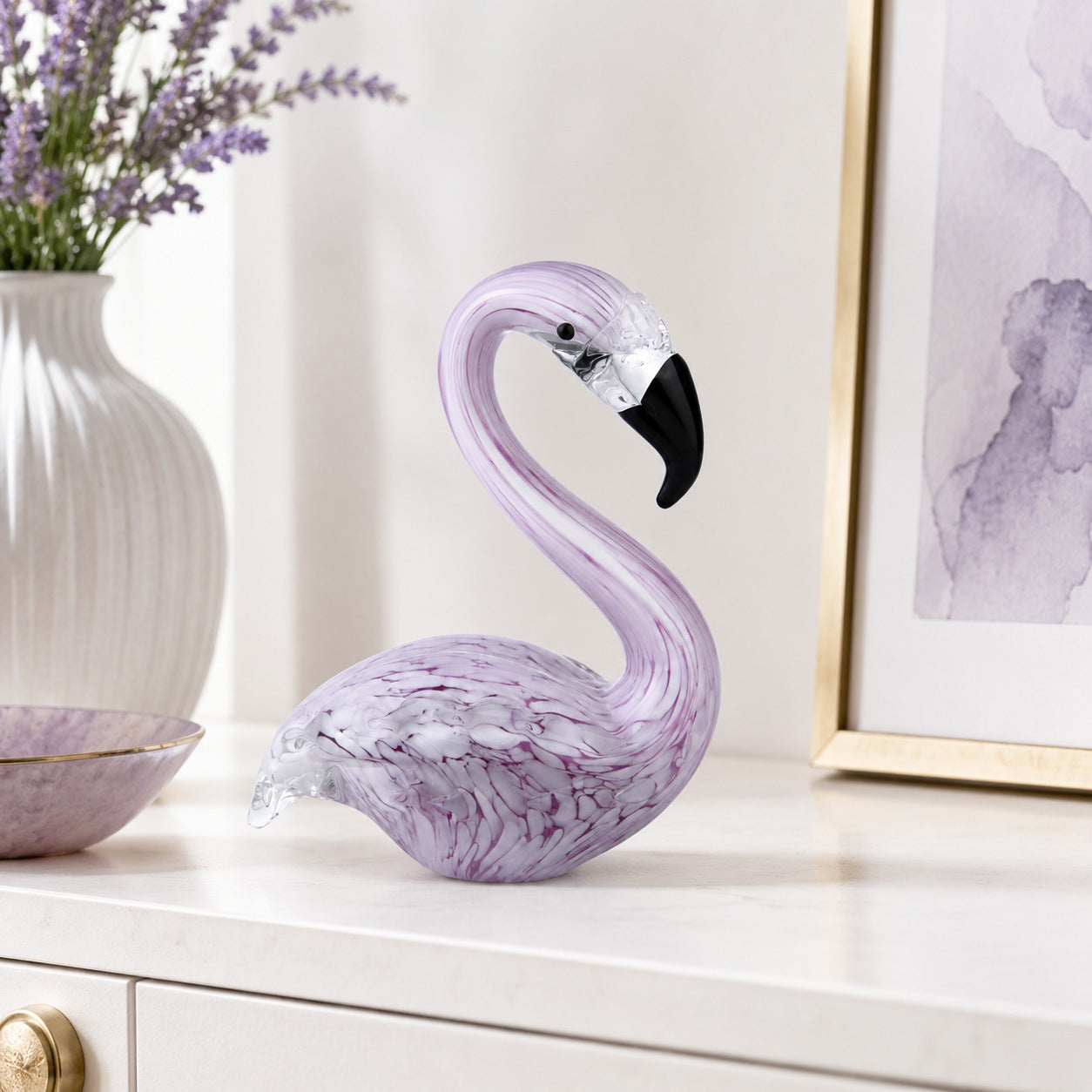 Purple glass flamingo desktop decor styled on luxury home office shelf